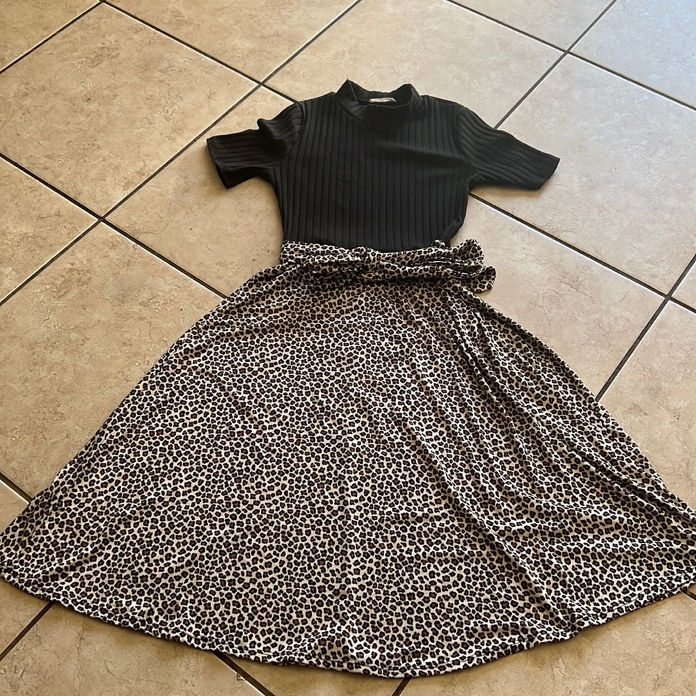 REB.in J brand size small leopard print on the bottom and black top